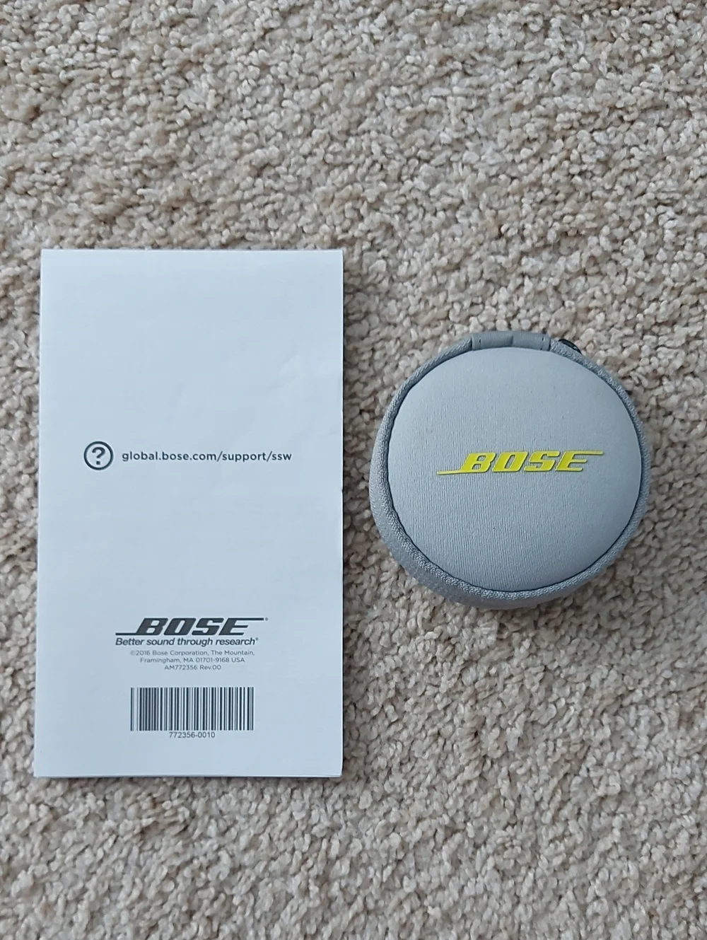 Bose Light Gray Round Earbud Case with Yellow Logo